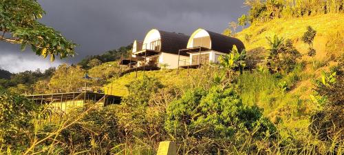 a house on the side of a hill at Tierra Vital Atenas Villa 2 in Atenas
