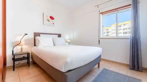 Quiet 2BR Retreat with Pool & Balcony by LovelyStay