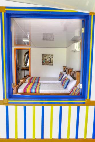 a bedroom with a bed inside of a house at Finca Nuevo Monarca in Pereira