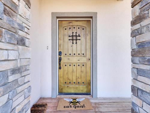 a front door with a bee sign on it at Timeless Hive in Parowan