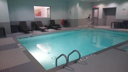 a large swimming pool in a hotel room at Novotel Toronto Vaughan Centre in Vaughan