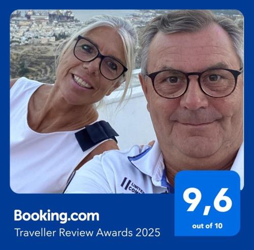 a man and a woman wearing glasses posing for a picture at ENJOY HOUSE in Ronchi