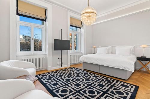 Postel nebo postele na pokoji v ubytování Vodickova Luxury Suites