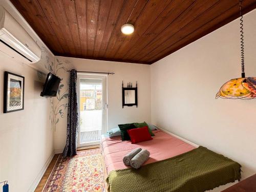 Postel nebo postele na pokoji v ubytování Casa Pássaro