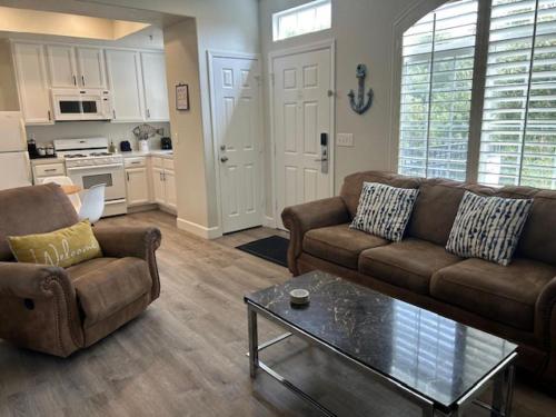 a living room with two couches and a coffee table at 444 Pier Avenue #510 in Oceano