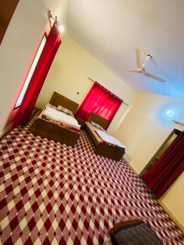 Postel nebo postele na pokoji v ubytování KK Sha Inn