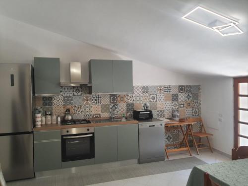 Kuchyň nebo kuchyňský kout v ubytování Artemide Residence Acquaviva