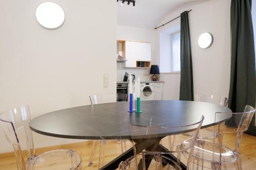 a dining room with a table and chairs at Belvedere City Apartment in Vienna
