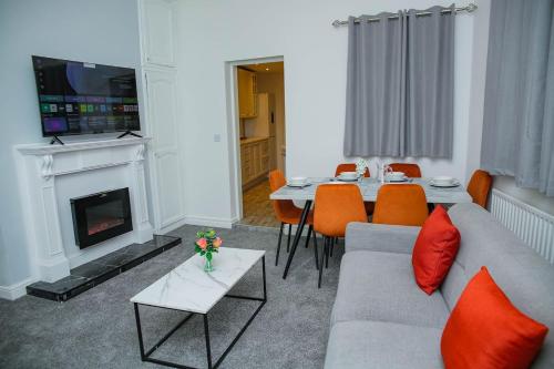 a living room with a couch and a fireplace at Brookland Avenue in Sunderland