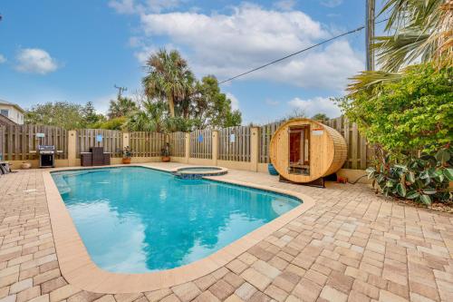 a swimming pool in a backyard with a fence at Watch Dolphins St Augustine Gem Near Downtown! in St. Augustine