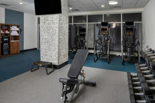 a gym with several exercise equipment in a room at Aloft Memphis Downtown in Memphis