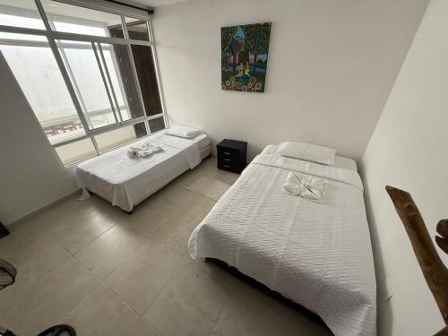 Voodi või voodid majutusasutuse Casa tranquila con jardín en Mocoa toas