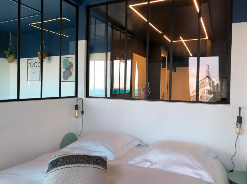 Postel nebo postele na pokoji v ubytování Appartement Design aux Porte de Paris