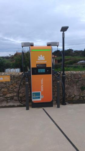 an orange gas pump in front of a wall at Villas Spa El Mirador de Isla in Isla