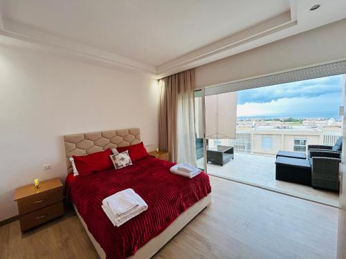 Postel nebo postele na pokoji v ubytování Azure Nest - Sea View Duplex with Golf and Pool Access in Taghazout Bay