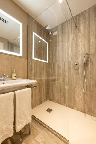 a bathroom with a shower and a sink at Palazzo Doni by Florence Art Apartments in Florence