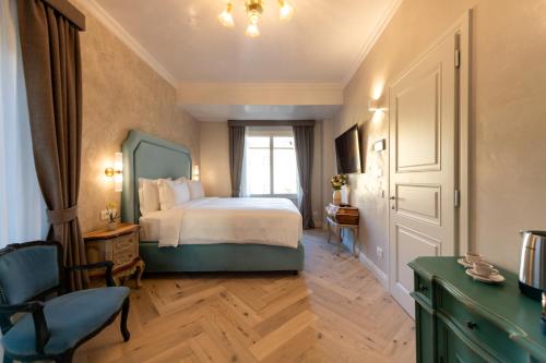 a hotel room with a bed and a window at Palazzo Doni by Florence Art Apartments in Florence