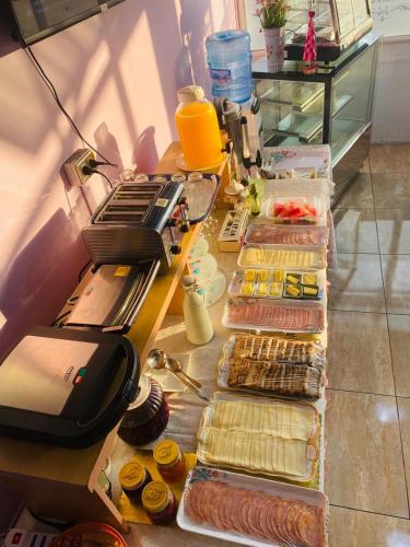 a table with different types of food on it at Hotel y Restaurant ISIDORA in Arica
