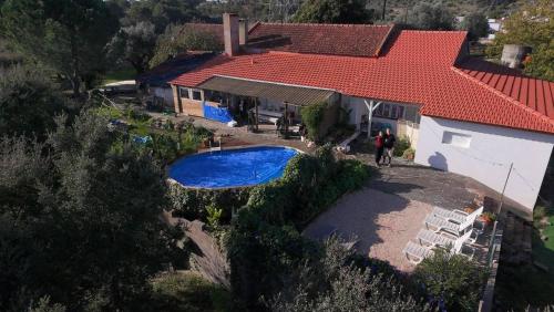 an aerial view of a house with a swimming pool at Quinta da Choupana in Tomar