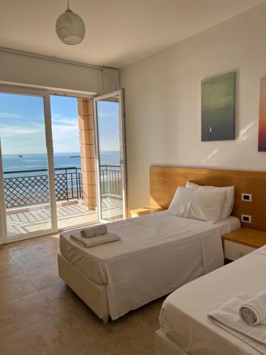 Postel nebo postele na pokoji v ubytování Hotel Brilant