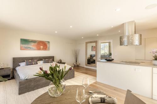 a kitchen and a bedroom with a bed and a table at 3921 Eyas, Big Sur home in Notleys Landing