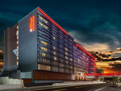 a rendering of a hotel at night at Hilton Garden Inn San Juan Condado in San Juan