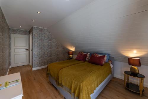 a bedroom with a bed in a attic at Tiismani Villa in Kärdla