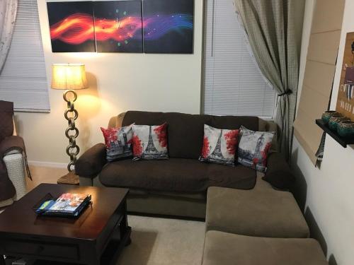 a living room with a couch and a coffee table at Home Near Disney Private Pool & Playground in Howey in the Hills
