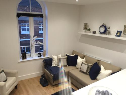 a living room with a couch and a window at Lincoln Retreat in Lincoln