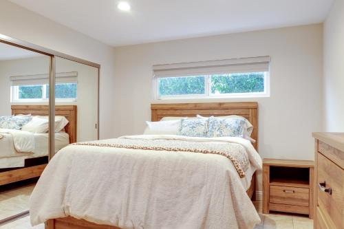 a white bedroom with two beds and a mirror at 2 Mi to Promenade at Westlake Mtn-View Haven! in Westlake Village