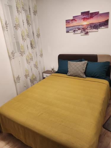 Llit o llits en una habitació de Apartman Nada