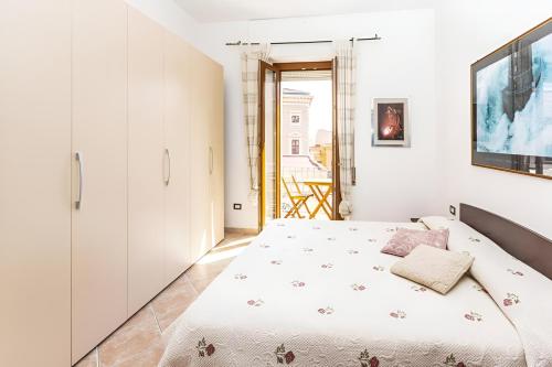 Ένα ή περισσότερα κρεβάτια σε δωμάτιο στο Splendido Appartamento in pieno Centro Dell'Isola