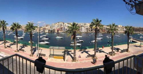 a view of a marina with boats in the water at Apartment Marsascala Seafront in Il-Kappara