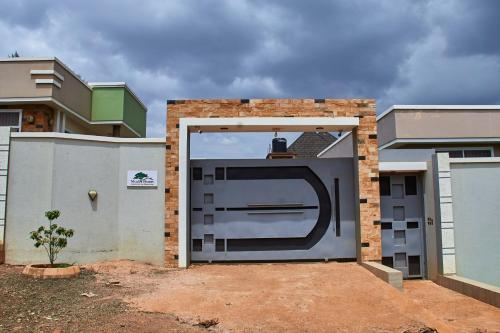 a large garage door in front of a house at Mvule Homes in Arusha