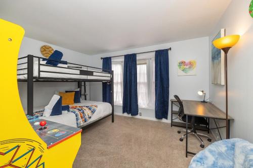 a bedroom with a bunk bed and a desk at New! Special Rate for First Bookings! 2 Bedroom in Charlotte
