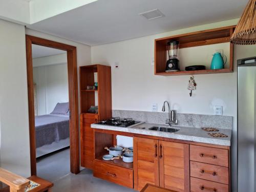 a kitchen with a sink and a counter top at Casa Liz in Itacaré
