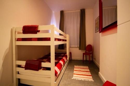 two bunk beds in a small room with a bedroom at City 60 in Verviers