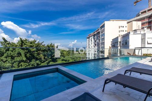 a swimming pool on the roof of a building at Lobie Gloria Del'Art in Rio de Janeiro