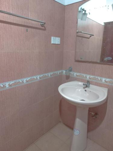 a bathroom with a sink and a mirror at Free House Bentota in Bentota