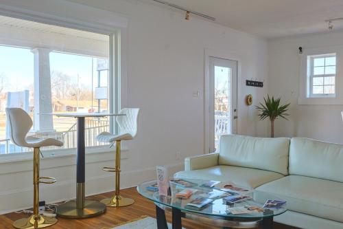 a living room with a couch and a glass table at Juliana Spa Suite - Entire Main Apartment in Winchester