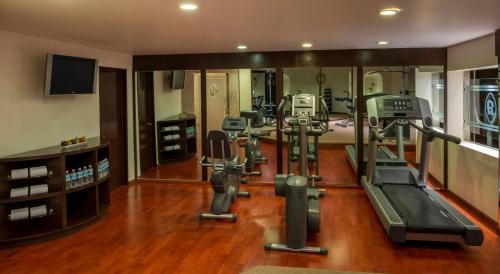 a gym with exercise equipment in a room at Quinta Real Zacatecas in Zacatecas