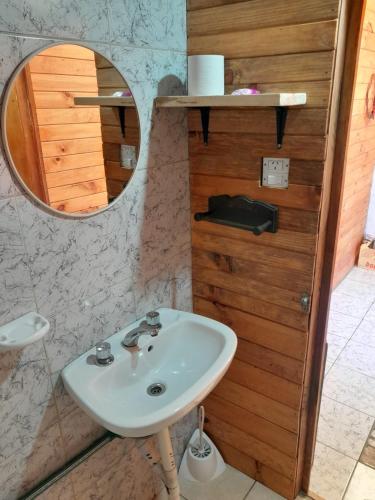 a bathroom with a sink and a mirror at La señal in Puerta del Diablo