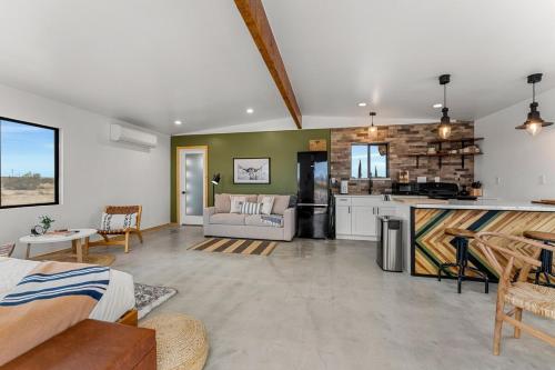 a large living room with a kitchen and a living room at Charming Hoover Hideaway - Studio - A Location in Joshua Tree