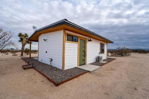a tiny house in the middle of the desert at Charming Hoover Hideaway - Studio - A Location in Joshua Tree