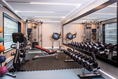 a gym with cardio equipment in a hotel room at DoubleTree by Hilton Santiago - Vitacura in Santiago
