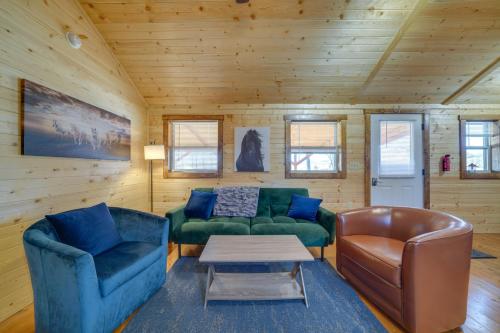 a living room with a couch and a table at 28 Mi to Downtown Louisville Serene Farm Getaway in La Grange