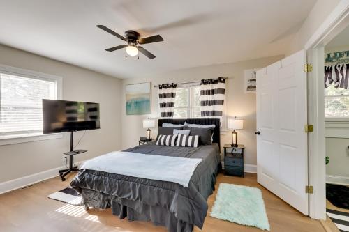 a bedroom with a bed and a ceiling fan at Less Than 2 Mi to ECU Cozy Greenville Getaway for Fall in Greenville