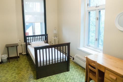 Кровать или кровати в номере Auberge de Jeunesse des Balcons