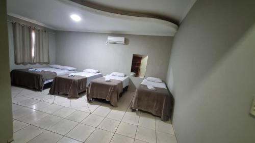 Ένα ή περισσότερα κρεβάτια σε δωμάτιο στο Hotel do Vale