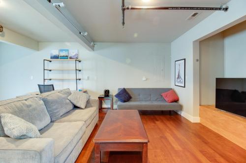 a living room with a couch and a table at Sisters Retreat Upper Lower in Sisters